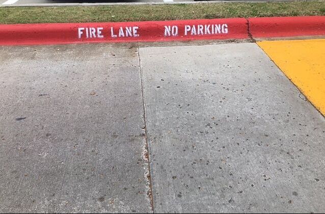 Fire lane stenciling on curbs Selma, Texas